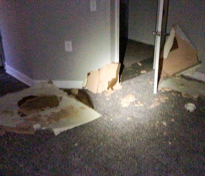 Denver home with wet carpet and falling ceiling due to water damage
