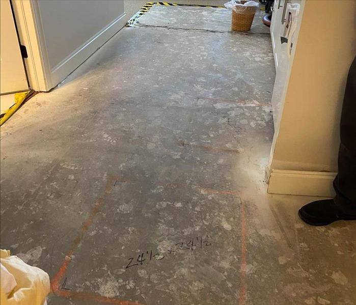 the water damaged flooring is removed leaving the concrete subfloors exposed