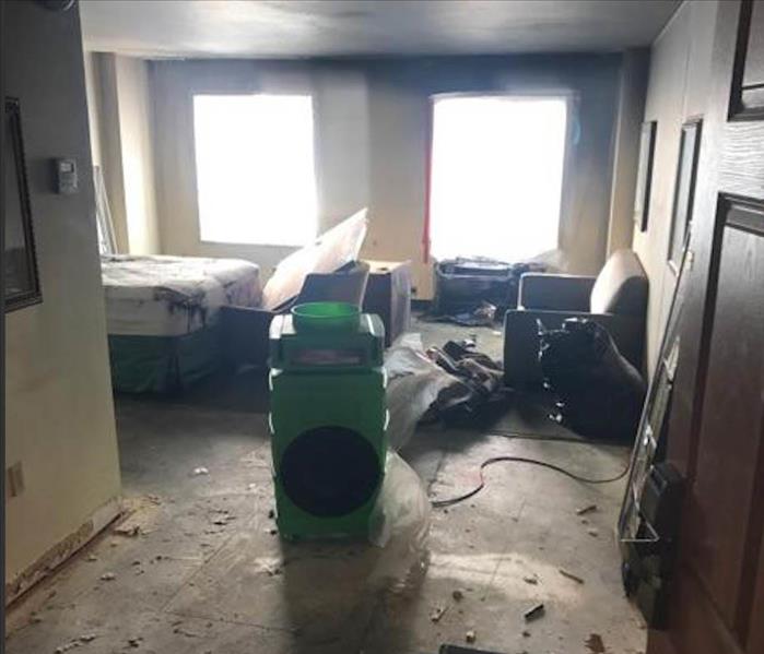 apartment room with secondary smoke and soot damage