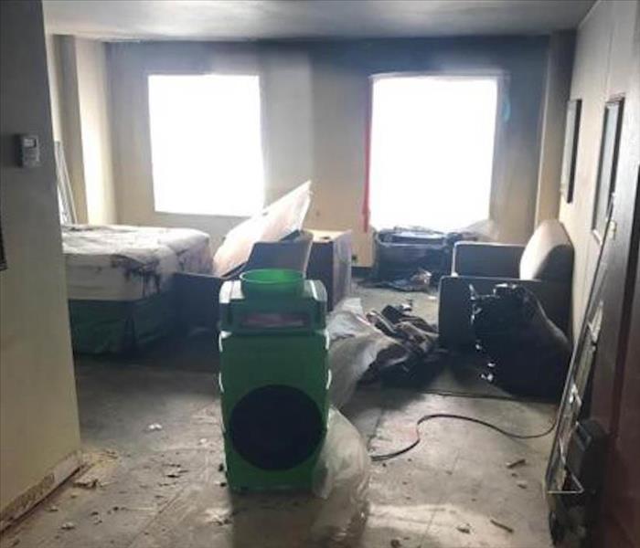 hotel room with water and fire damage