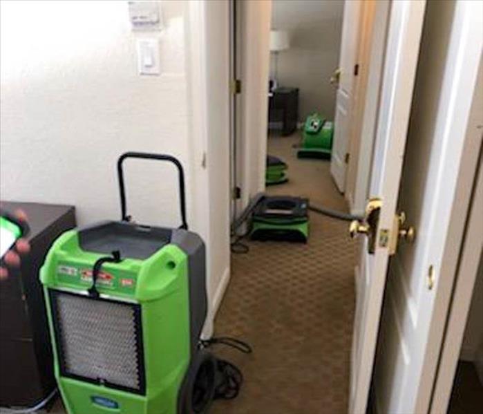 Air movers in home after water damage